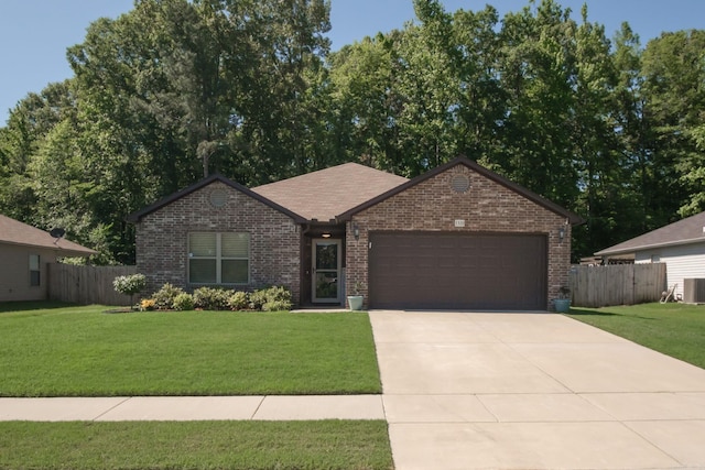 ranch-style house with a front yard, a garage, and cooling unit