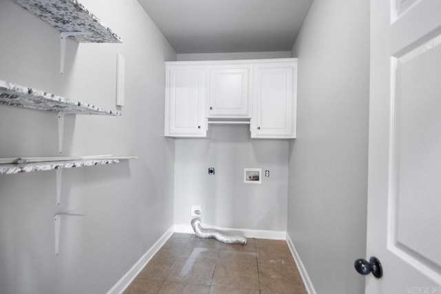 laundry room with hookup for an electric dryer, cabinets, hookup for a washing machine, and dark tile patterned flooring