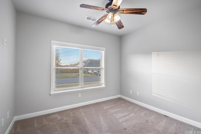 carpeted empty room with ceiling fan