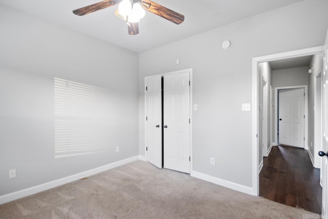 unfurnished bedroom with carpet and ceiling fan