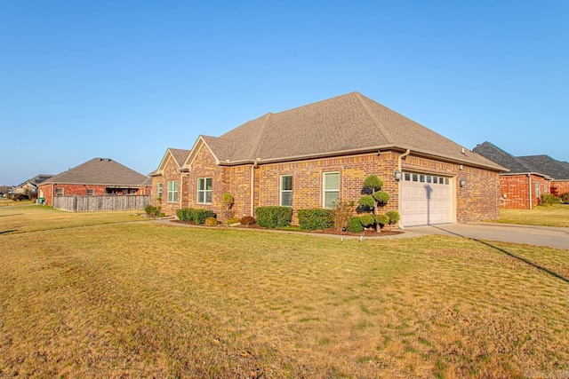 view of front of home featuring a garage and a front lawn