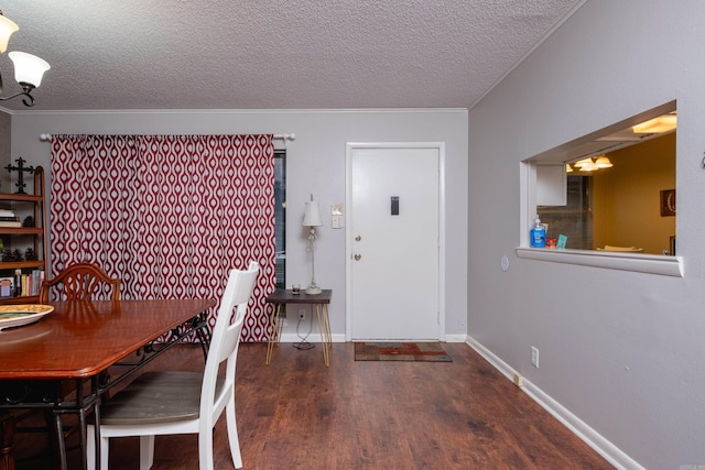 unfurnished dining area with dark hardwood / wood-style flooring and a textured ceiling