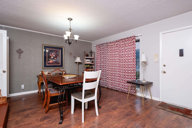 dining area featuring dark hardwood / wood-style floors, ornamental molding, and a notable chandelier