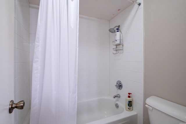 bathroom with shower / tub combo and toilet