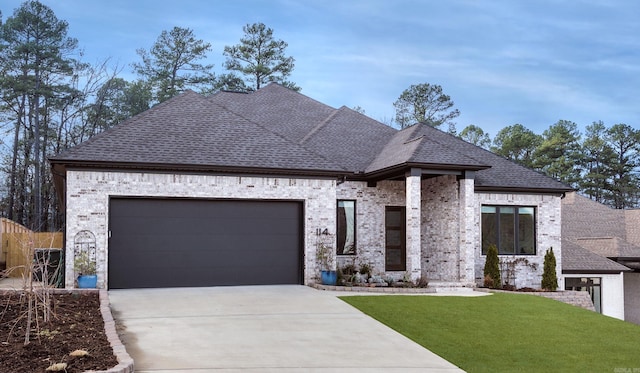 view of front facade with a garage and a front yard