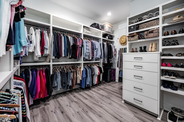 walk in closet featuring light hardwood / wood-style floors