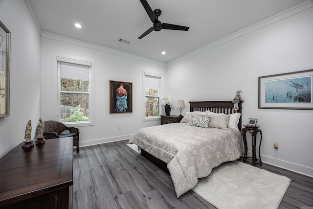 bedroom with ceiling fan, crown molding, and wood-type flooring