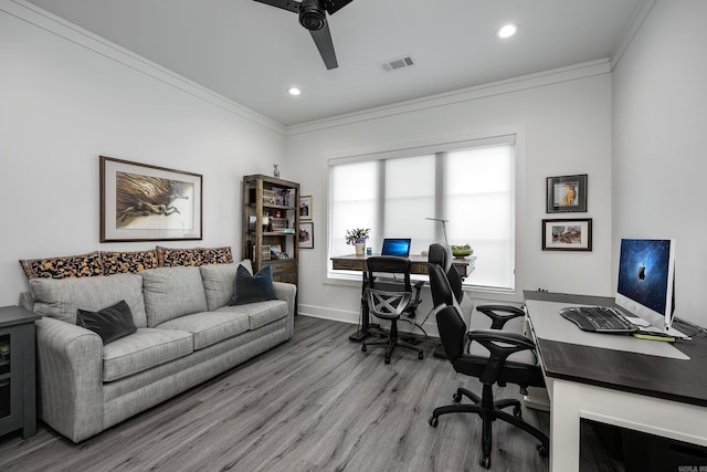 office space featuring light hardwood / wood-style flooring, ceiling fan, and crown molding