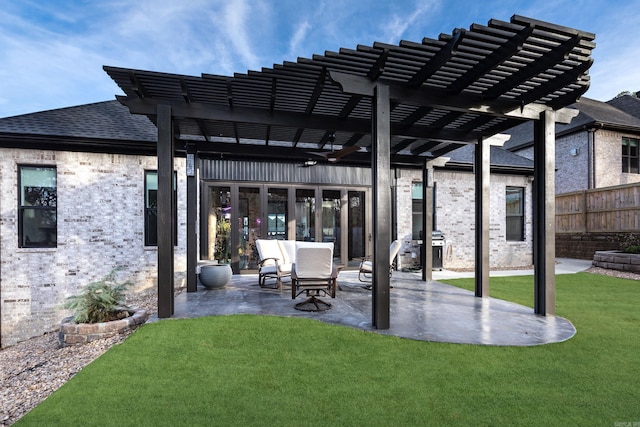 view of patio featuring a pergola, ceiling fan, and grilling area