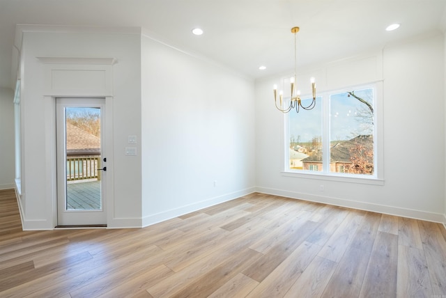 110 Eagle Ridge Dr, Maumelle, AR 72113 - unfurnished dining area with light hardwood / wood-style flooring and a chandelier