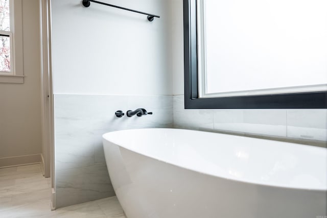 110 Eagle Ridge Dr, Maumelle, AR 72113 - bathroom featuring a tub to relax in and tile walls