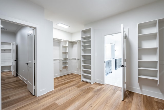 110 Eagle Ridge Dr, Maumelle, AR 72113 - walk in closet with light wood-type flooring