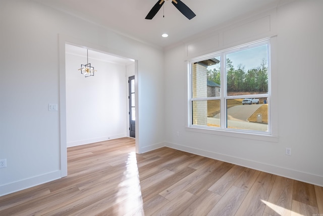 110 Eagle Ridge Dr, Maumelle, AR 72113 - spare room featuring light hardwood / wood-style floors and ceiling fan with notable chandelier