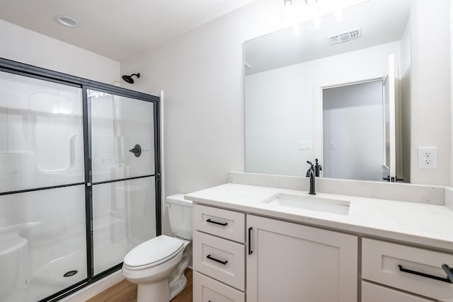 110 Eagle Ridge Dr, Maumelle, AR 72113 - bathroom featuring hardwood / wood-style floors, vanity, an enclosed shower, and toilet