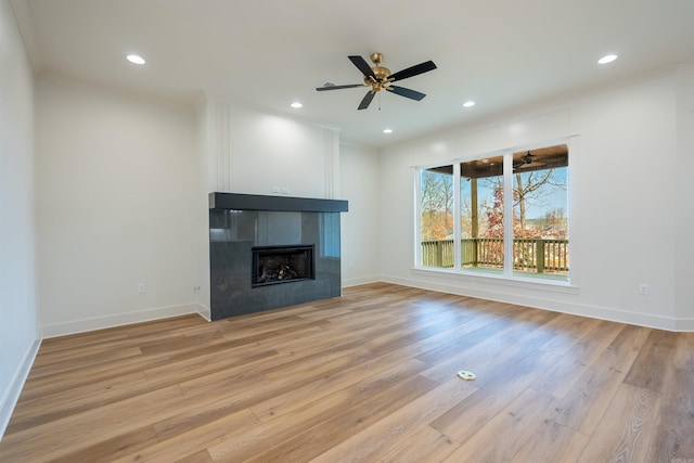 110 Eagle Ridge Dr, Maumelle, AR 72113 - unfurnished living room featuring crown molding, ceiling fan, a fireplace, and light hardwood / wood-style floors