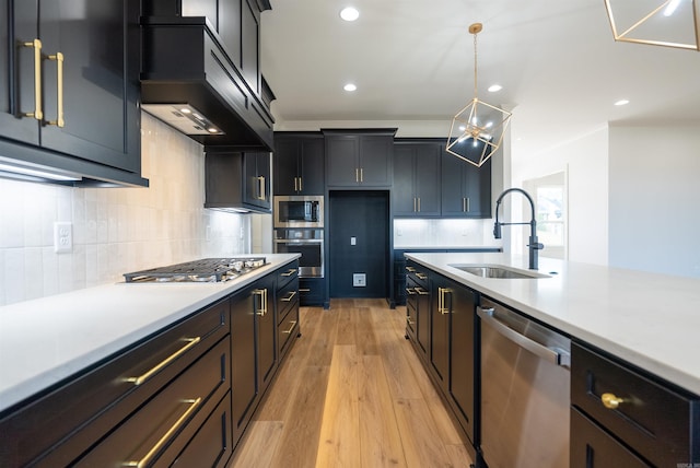 110 Eagle Ridge Dr, Maumelle, AR 72113 - kitchen with appliances with stainless steel finishes, custom range hood, sink, decorative light fixtures, and light hardwood / wood-style flooring