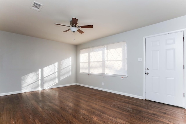 interior space featuring ceiling fan and dark wood-type flooring