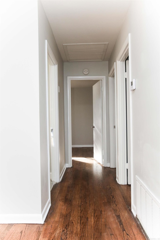 corridor featuring dark hardwood / wood-style floors