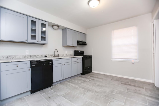 kitchen with black appliances, gray cabinetry, and sink