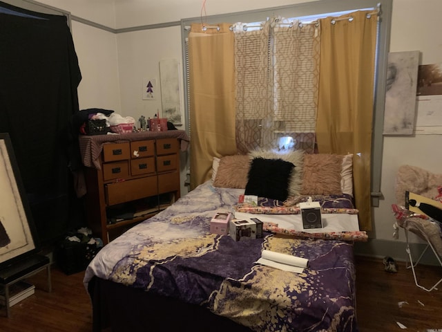 bedroom featuring dark hardwood / wood-style flooring