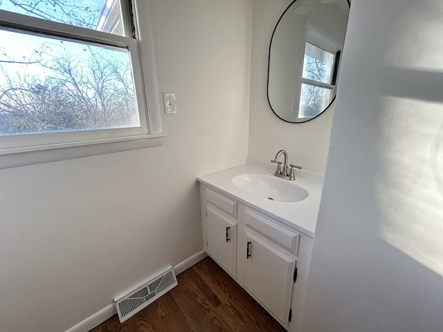 bathroom featuring vanity and hardwood / wood-style flooring