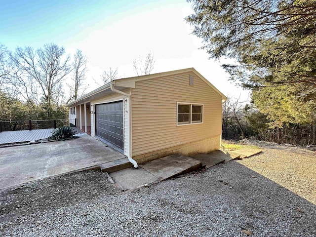 view of side of home with a garage