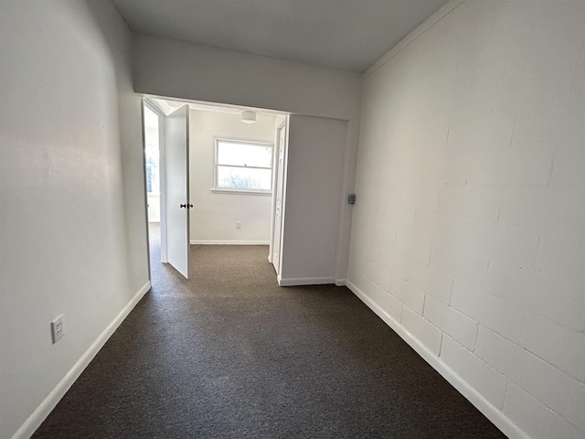 interior space with dark colored carpet