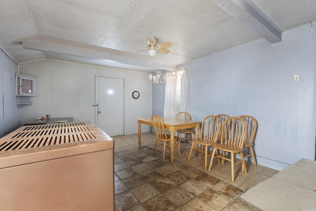 dining room with ceiling fan, crown molding, lofted ceiling with beams, and a textured ceiling