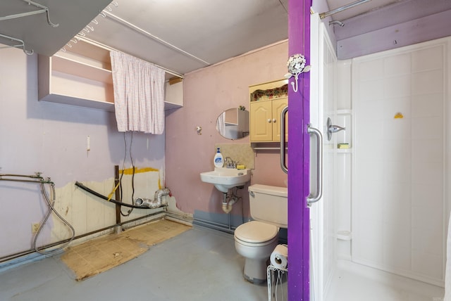 bathroom with toilet, concrete flooring, and walk in shower