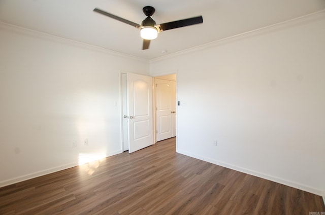 unfurnished room with ceiling fan, crown molding, and dark hardwood / wood-style floors