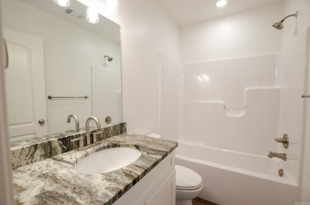 full bathroom featuring toilet, shower / bathtub combination, and vanity