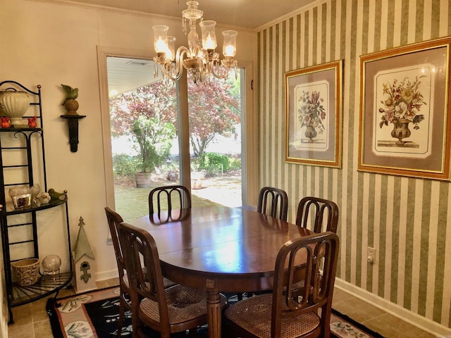 dining space featuring ornamental molding, a notable chandelier, and light tile patterned flooring