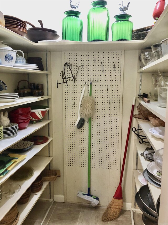 walk in closet featuring tile patterned flooring