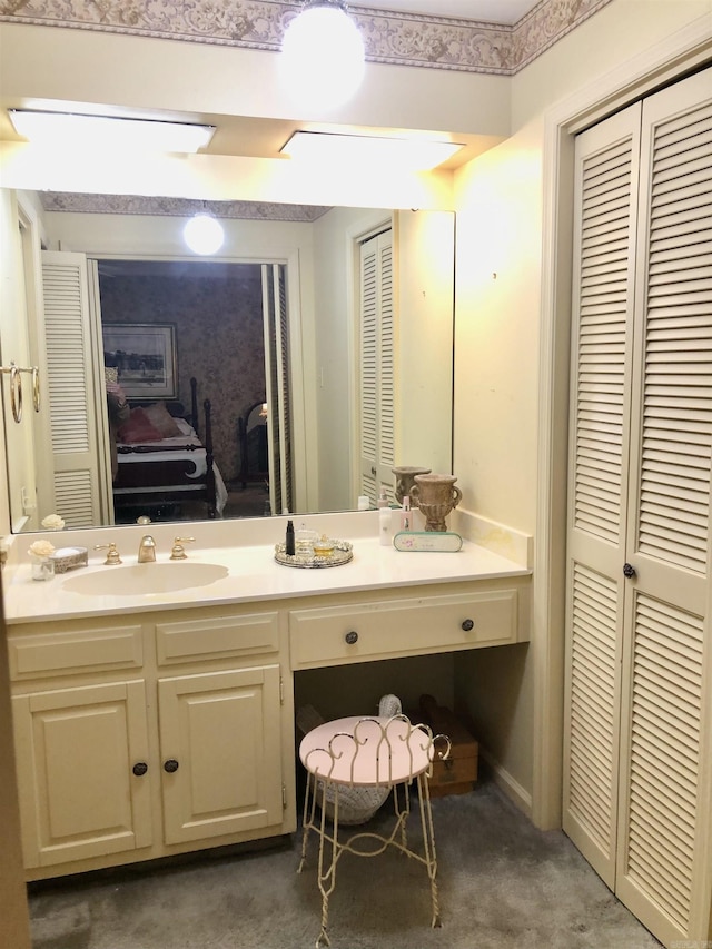 bathroom featuring vanity and concrete floors