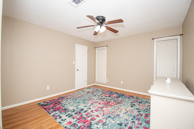 interior space featuring ceiling fan and wood-type flooring