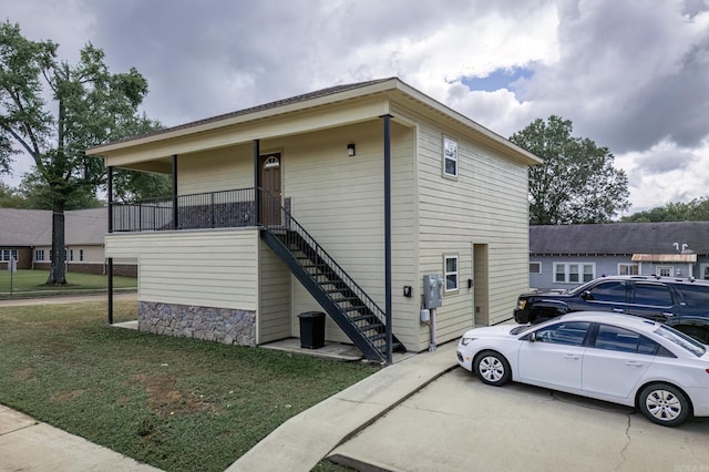 view of property exterior featuring a lawn