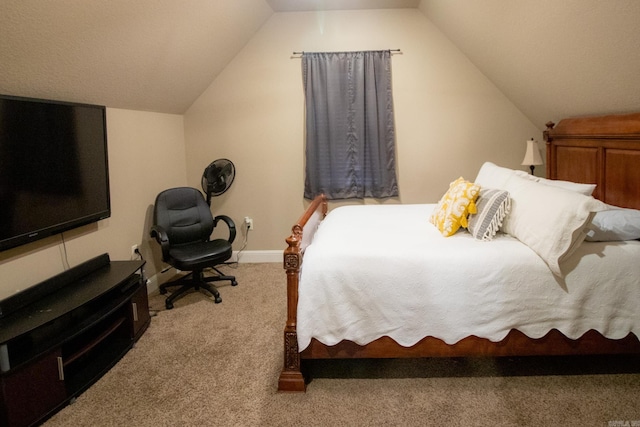 carpeted bedroom featuring lofted ceiling