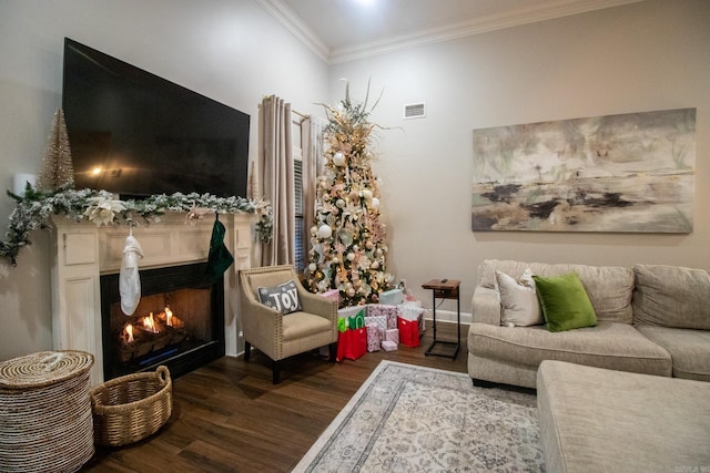 living area featuring ornamental molding and dark hardwood / wood-style flooring