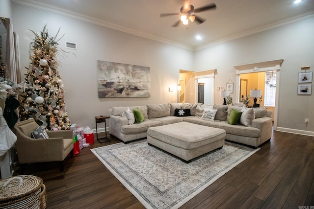 living room featuring ceiling fan, dark hardwood / wood-style flooring, and ornamental molding