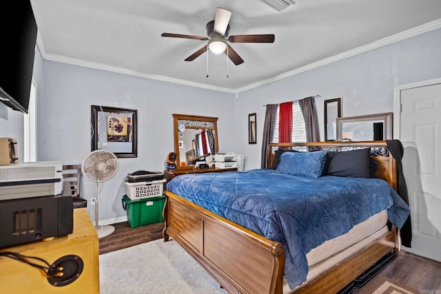 bedroom with ceiling fan, dark hardwood / wood-style flooring, and crown molding