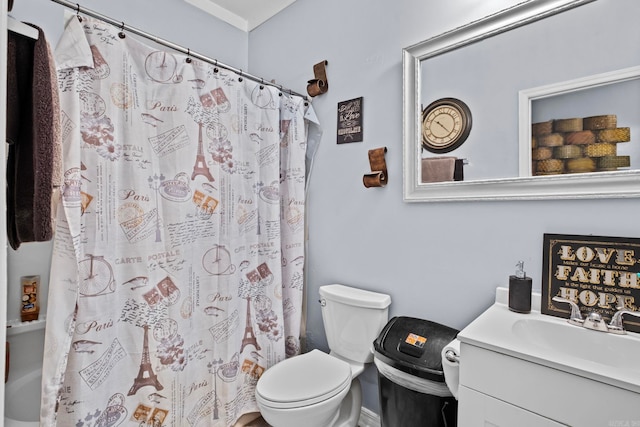 bathroom featuring walk in shower, vanity, and toilet