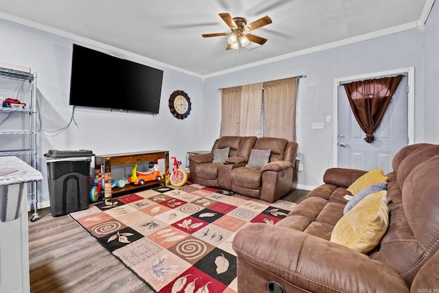 living room with ceiling fan, hardwood / wood-style floors, and ornamental molding