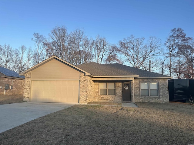 ranch-style home featuring a front lawn and a garage