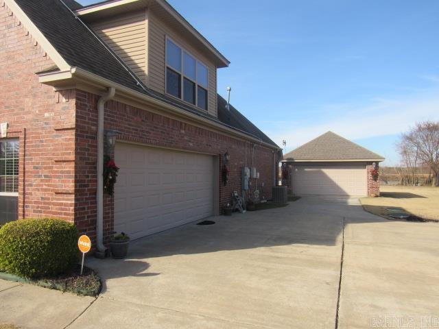 view of home's exterior featuring central air condition unit and a garage