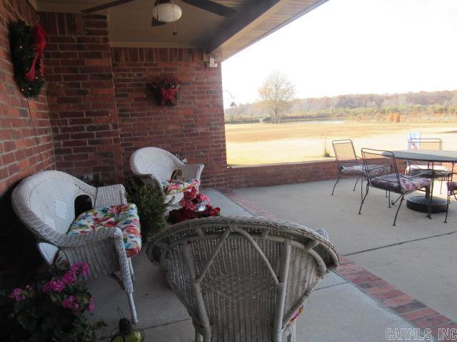 view of patio / terrace featuring ceiling fan