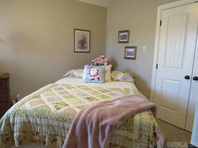 carpeted bedroom with a closet