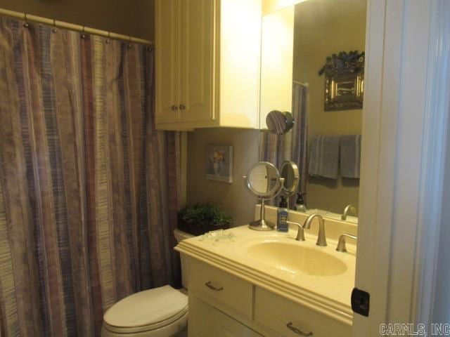 bathroom featuring vanity and toilet