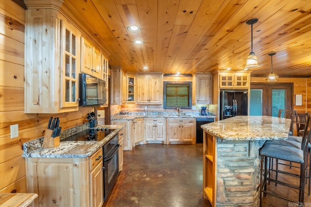 kitchen featuring hanging light fixtures, light stone counters, black appliances, a kitchen island, and wood ceiling