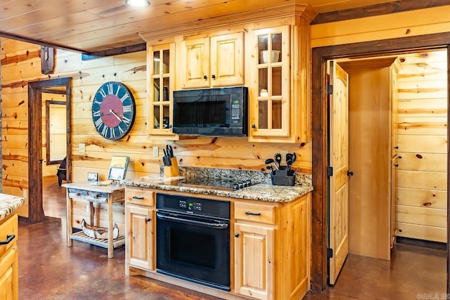 kitchen featuring light stone countertops, wood walls, black appliances, light brown cabinetry, and wood ceiling