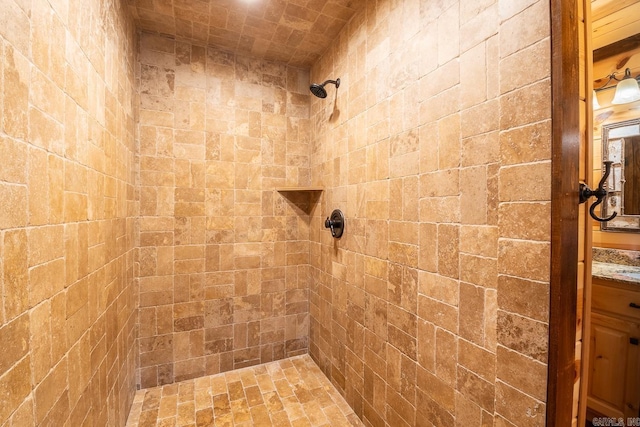 bathroom with tiled shower